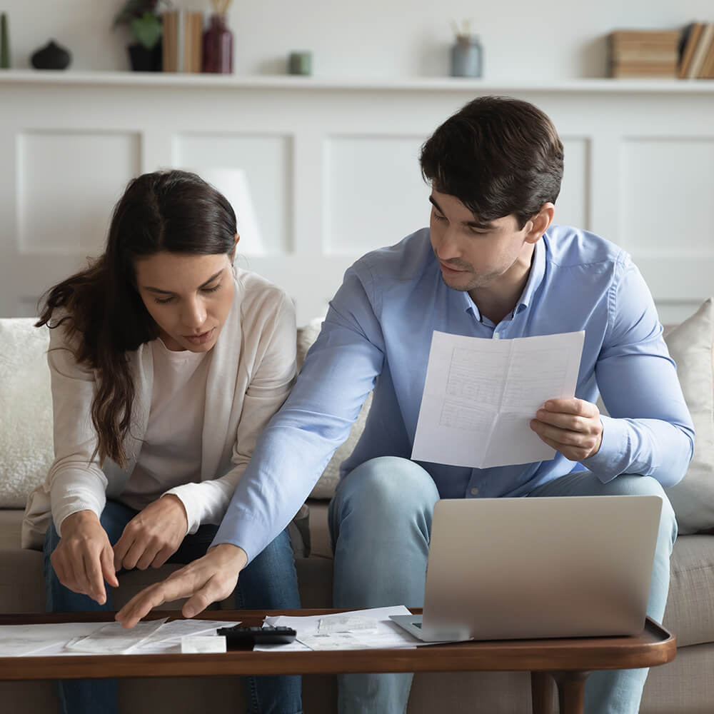 couple reading over papers together