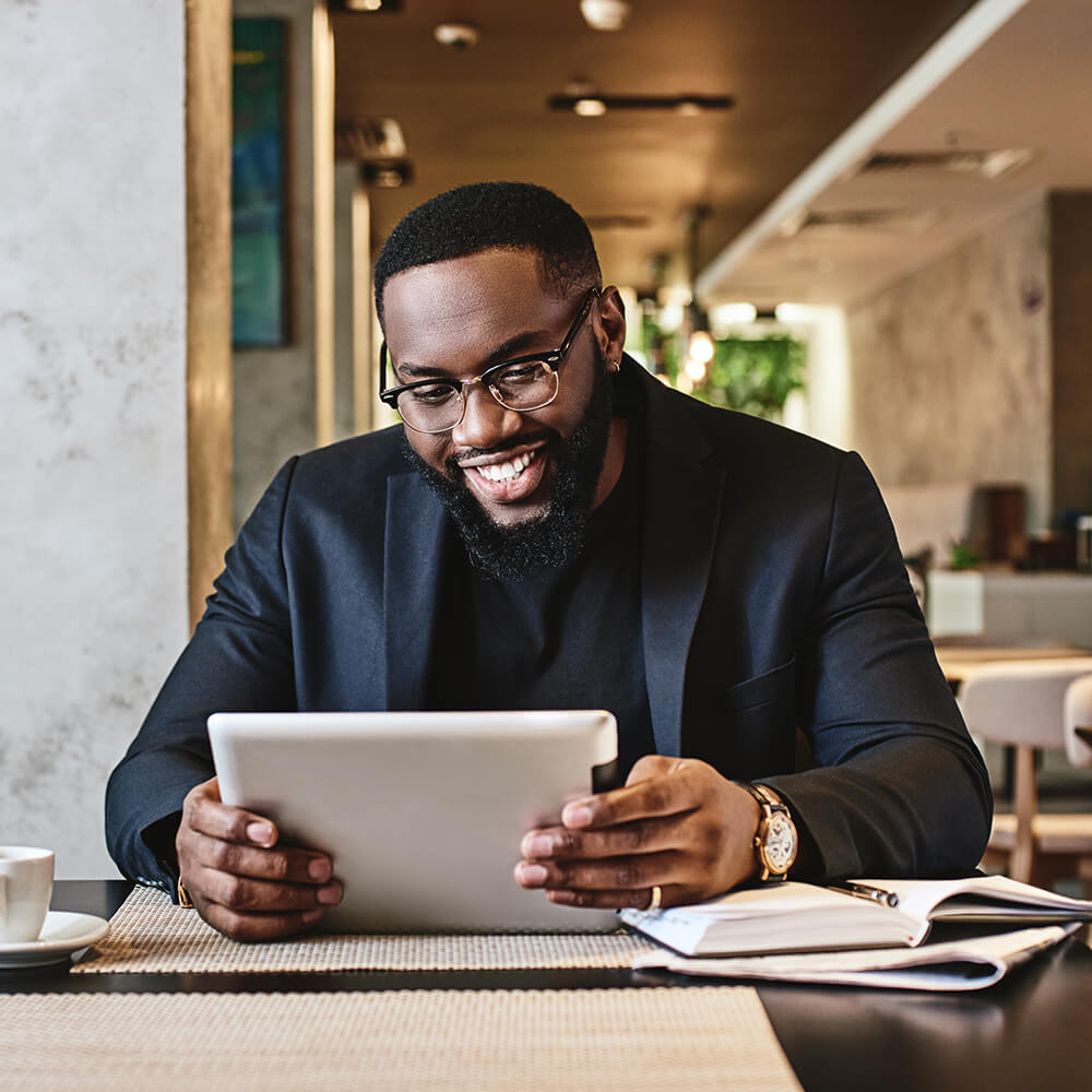 man on iPad in lobby