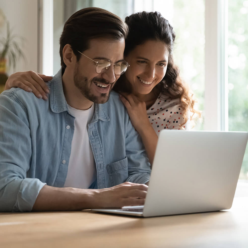 two people looking at computer screen