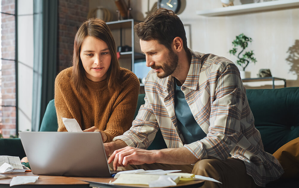 couple using laptop