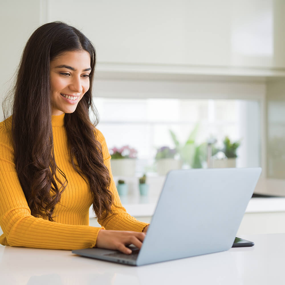 younger woman on laptop