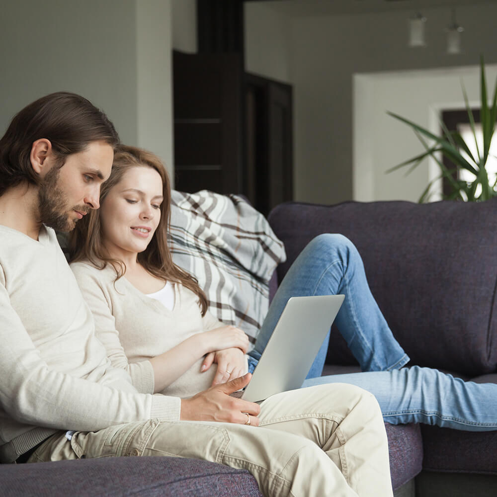 couple on sofa applying for 300 loan