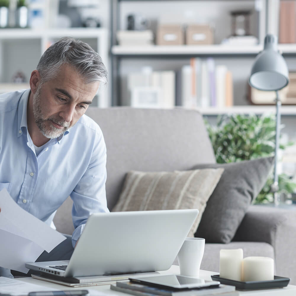 older man looking through paperwork