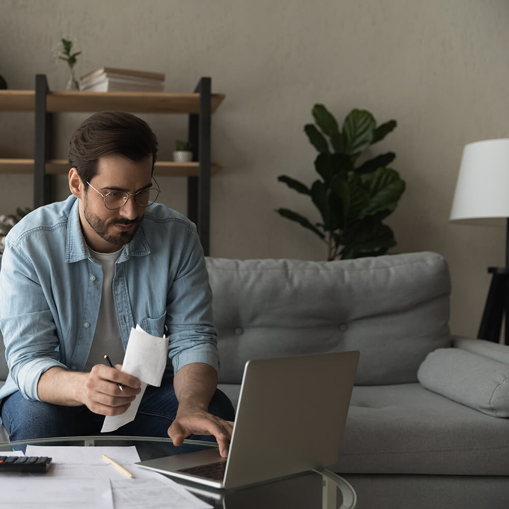 man staring intensely at laptop