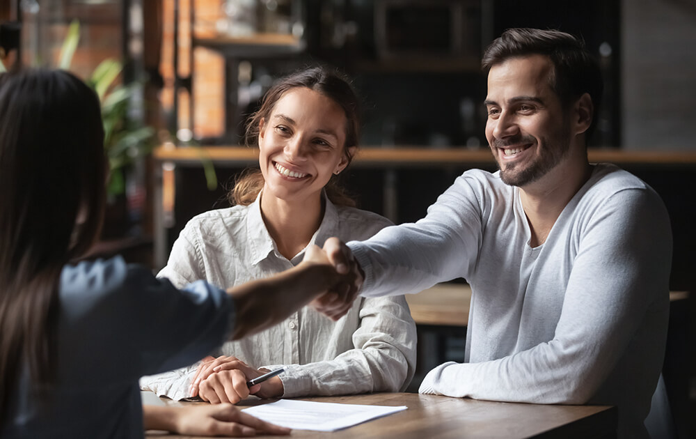 man shaking hand with women