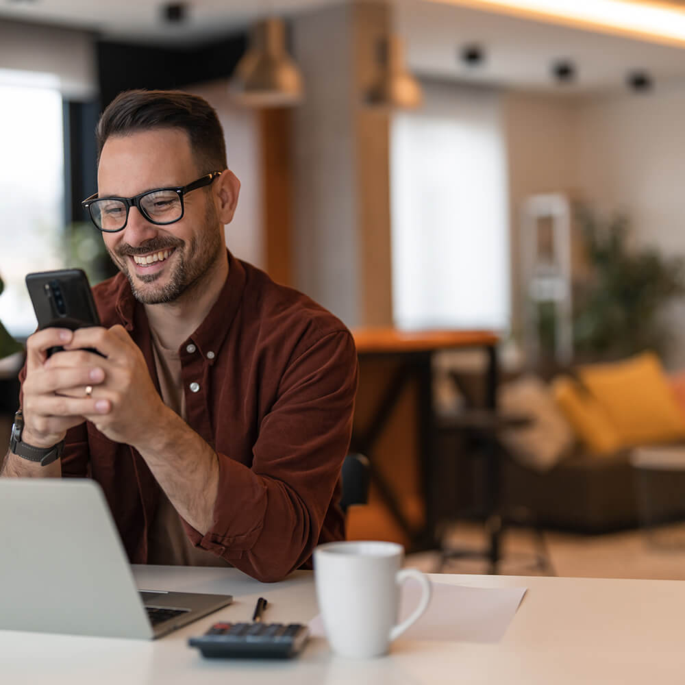 man on phone with coffee