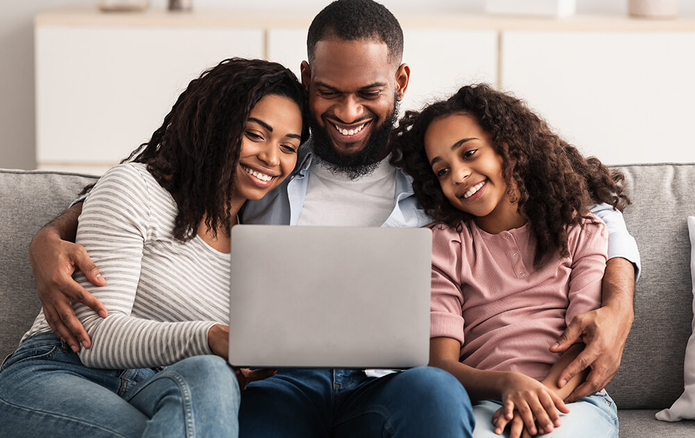 family using laptop