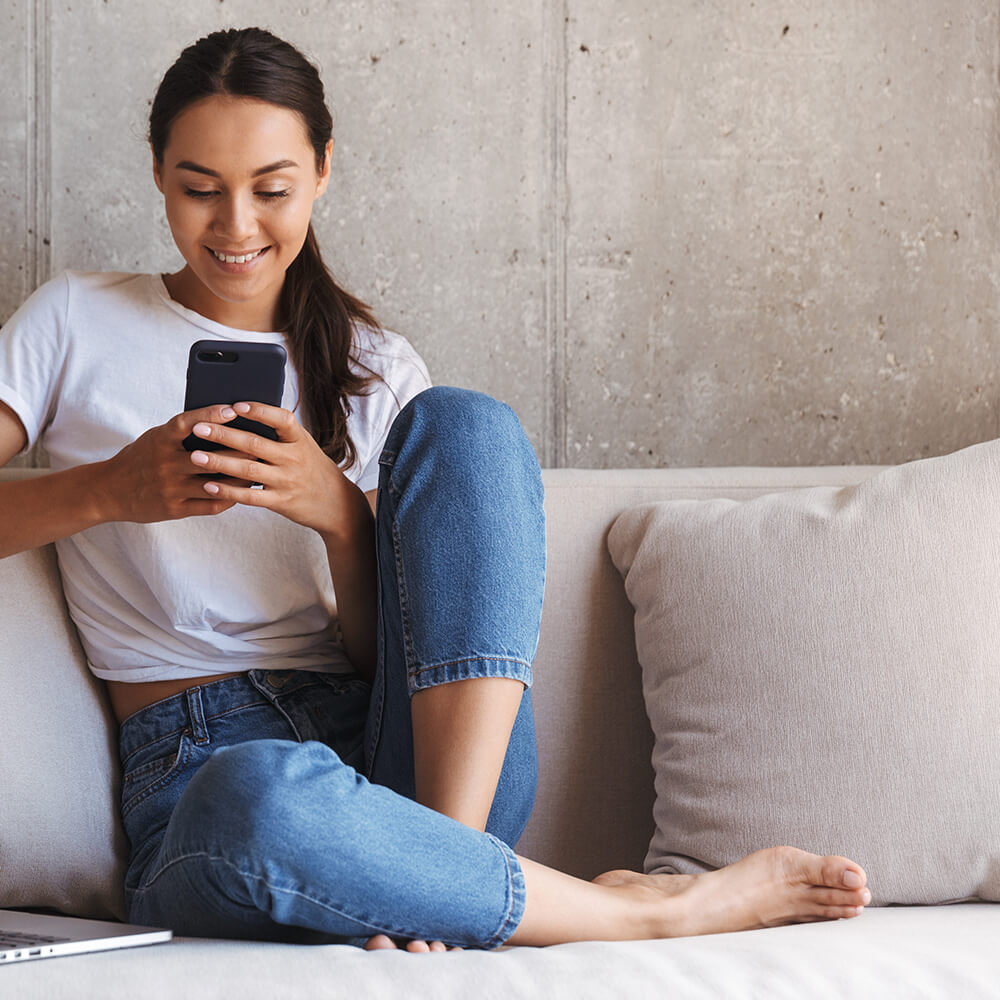 woman smiling at phone