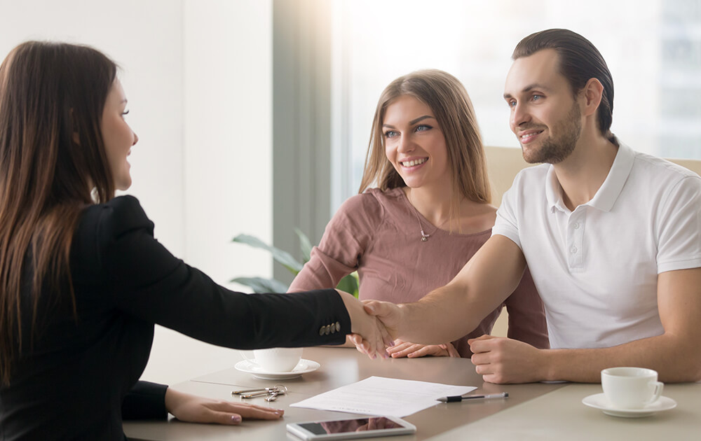 shaking hands after being accepted for a loan