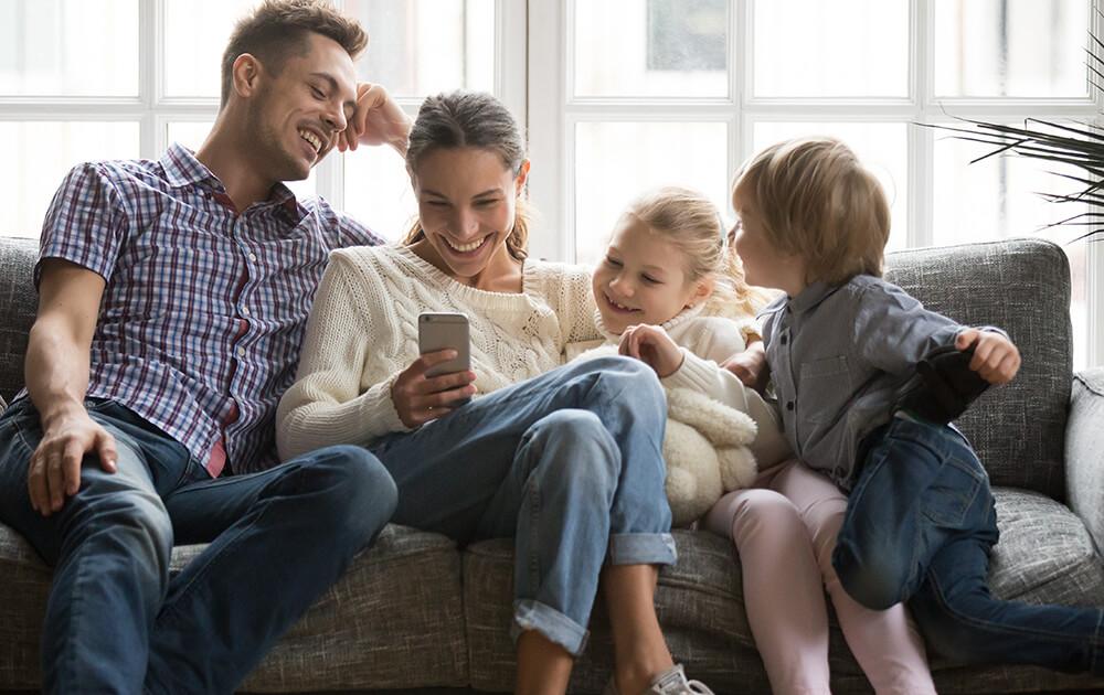 family looking at phone