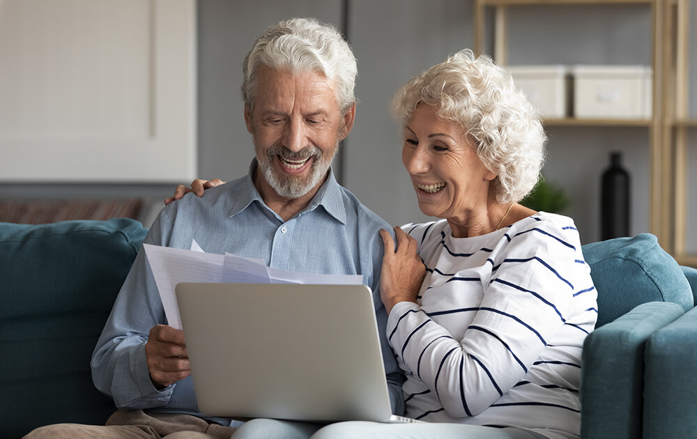 elderly people reading letter