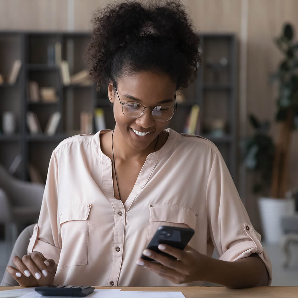 woman smiling it phone