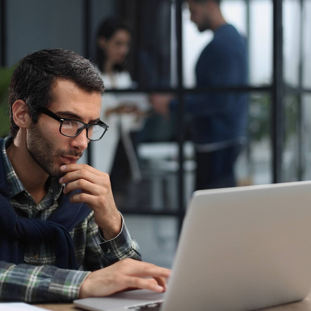 man on laptop in office
